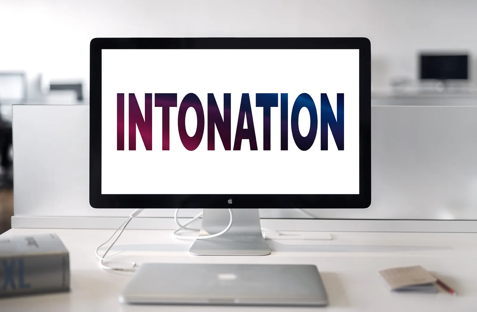 A desktop monitor displaying the word Intonation